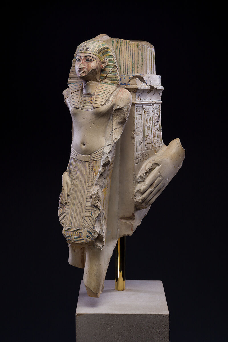Figure of a king as part of a group proffered by an official of Ramesses II, Limestone, paint