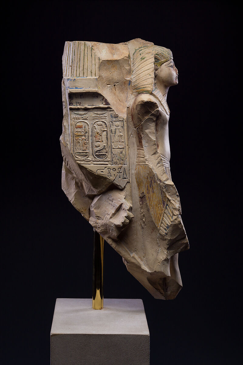 Figure of a king as part of a group proffered by an official of Ramesses II, Limestone, paint