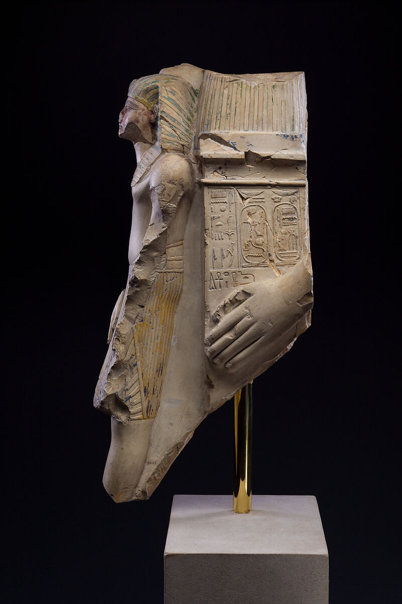 Figure of a king as part of a group proffered by an official of Ramesses II, Limestone, paint
