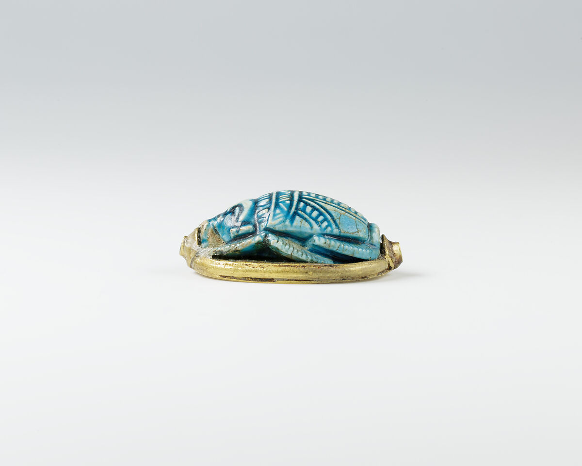 Human-headed scarab with device of sphinx and winged uraeus, Glazed steatite, gold
