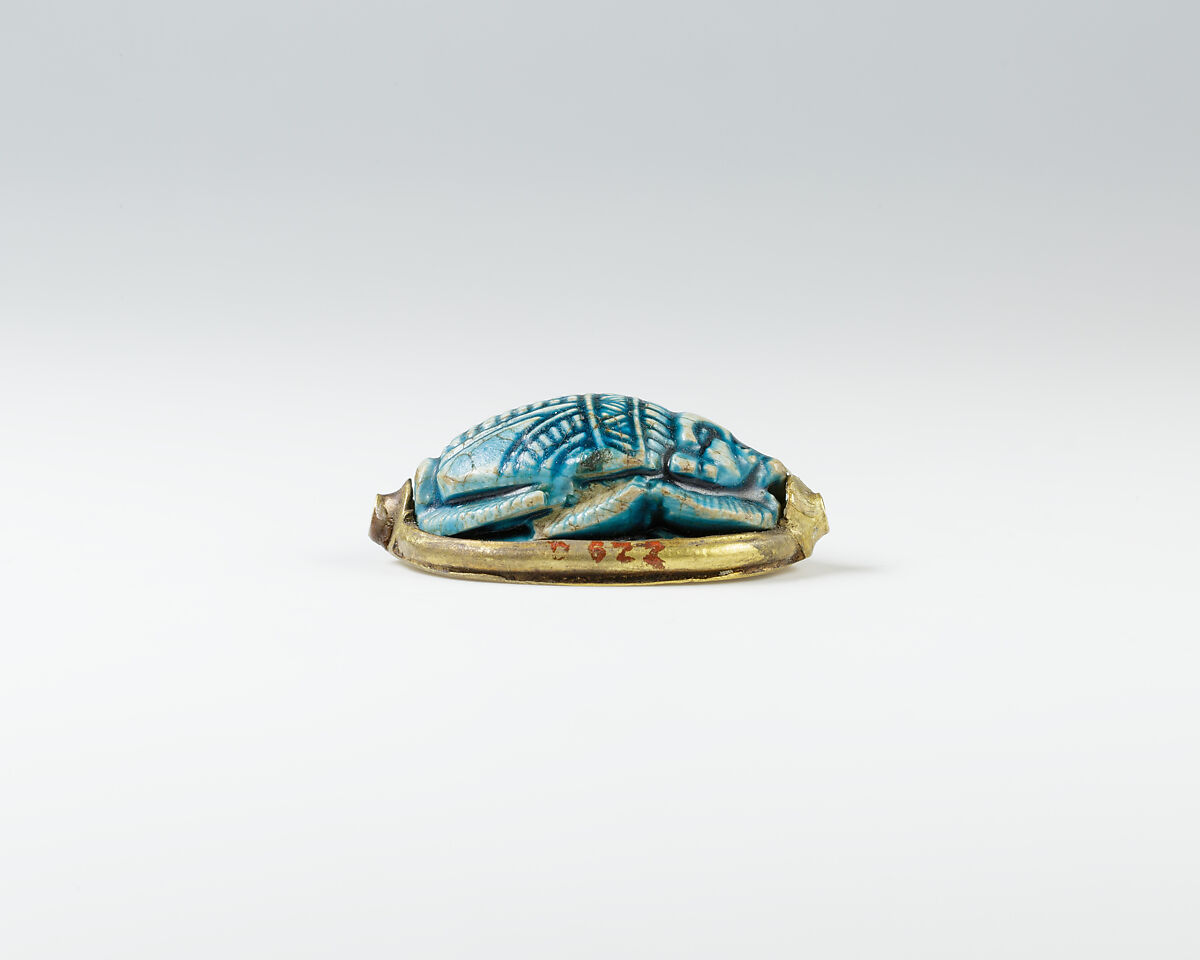 Human-headed scarab with device of sphinx and winged uraeus, Glazed steatite, gold