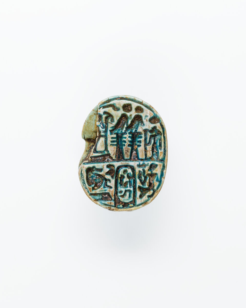 Scarab with ornate back including prenomen of Ramesses II and the phrase beloved of Maat and Thoth, Glazed steatite