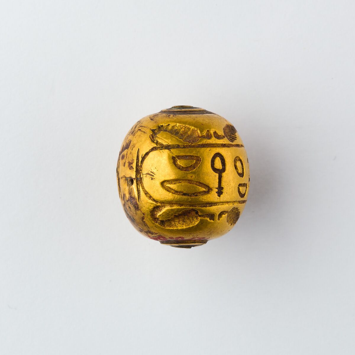 Hollow spherical bead with the Names of  Ramesses II and Queen Isetnefret, Gold
