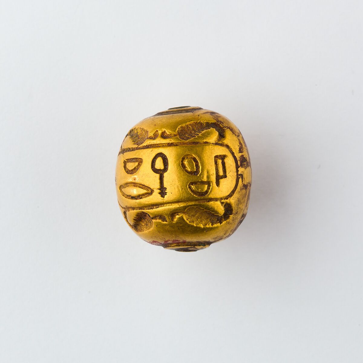 Hollow spherical bead with the Names of  Ramesses II and Queen Isetnefret, Gold