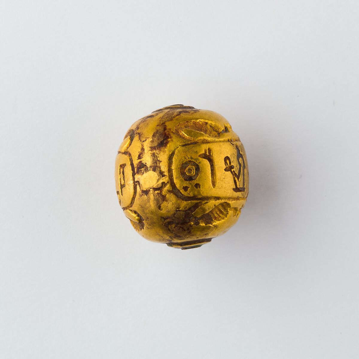Hollow spherical bead with the Names of  Ramesses II and Queen Isetnefret, Gold
