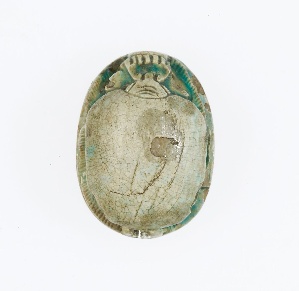 Scarab Inscribed With the Prenomen of Ramesses II and depicting the king in his chariot trampling an enemy, Steatite, blue glaze