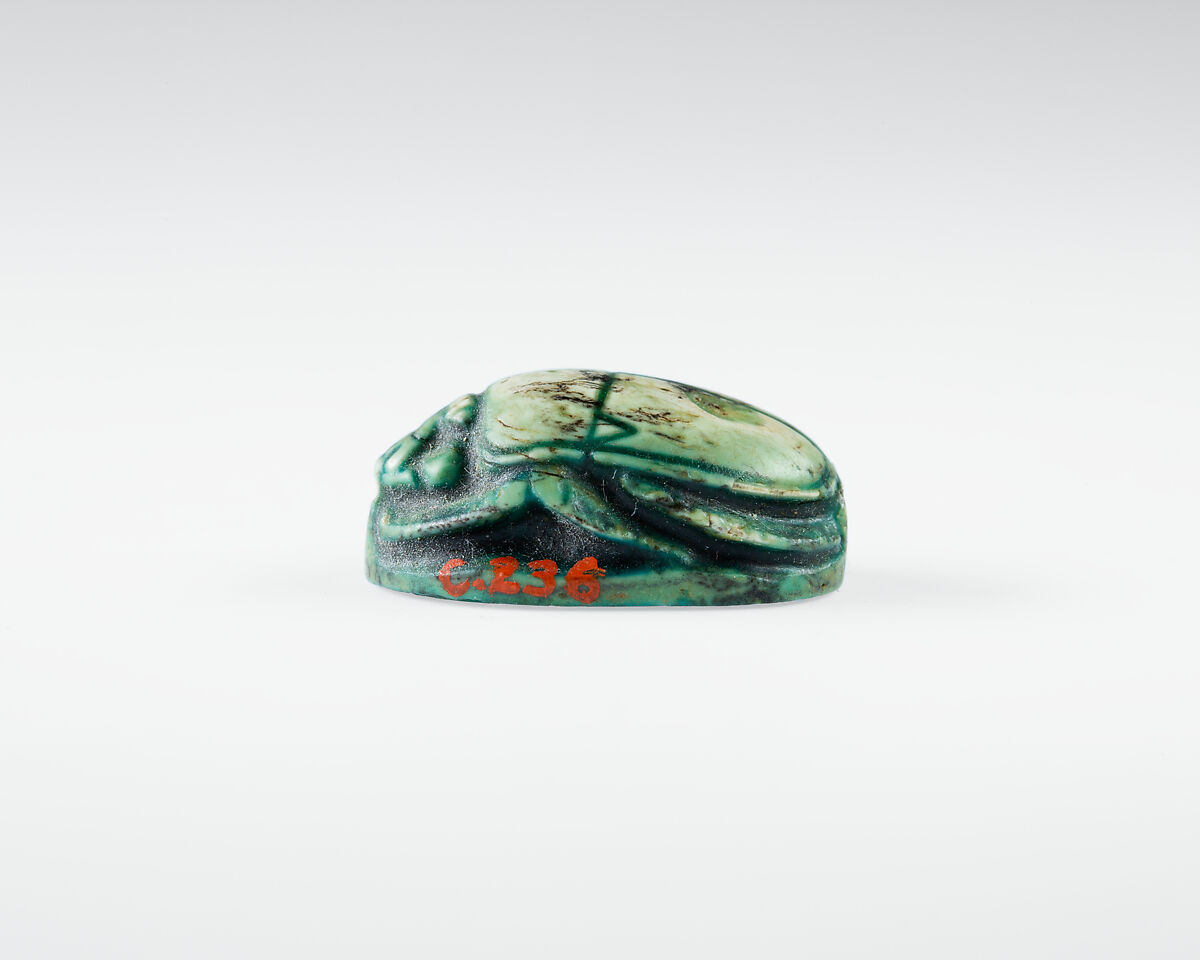 Scarab Depicting Seti II In His Chariot Shooting a Bow and Arrow., Glazed steatite