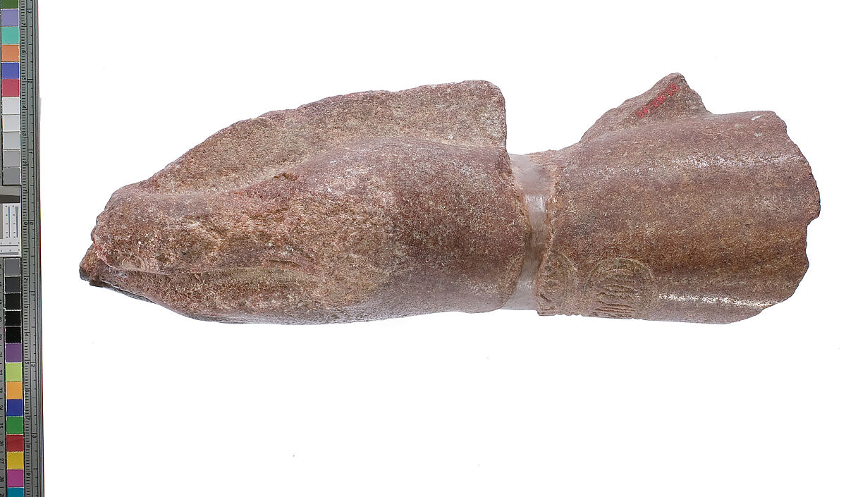 left hand and arm fragment with Aten cartouches from a statue supporting a stela?, Red quartzite