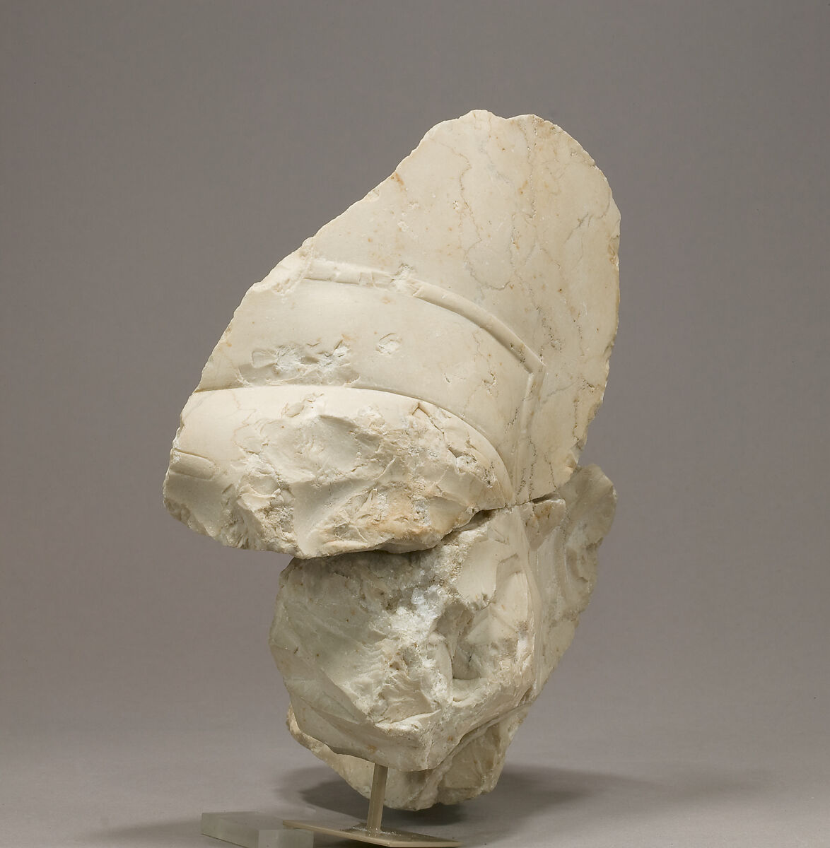 Head of Akhenaten in the blue crown, sign traces at nape of neck, Indurated limestone