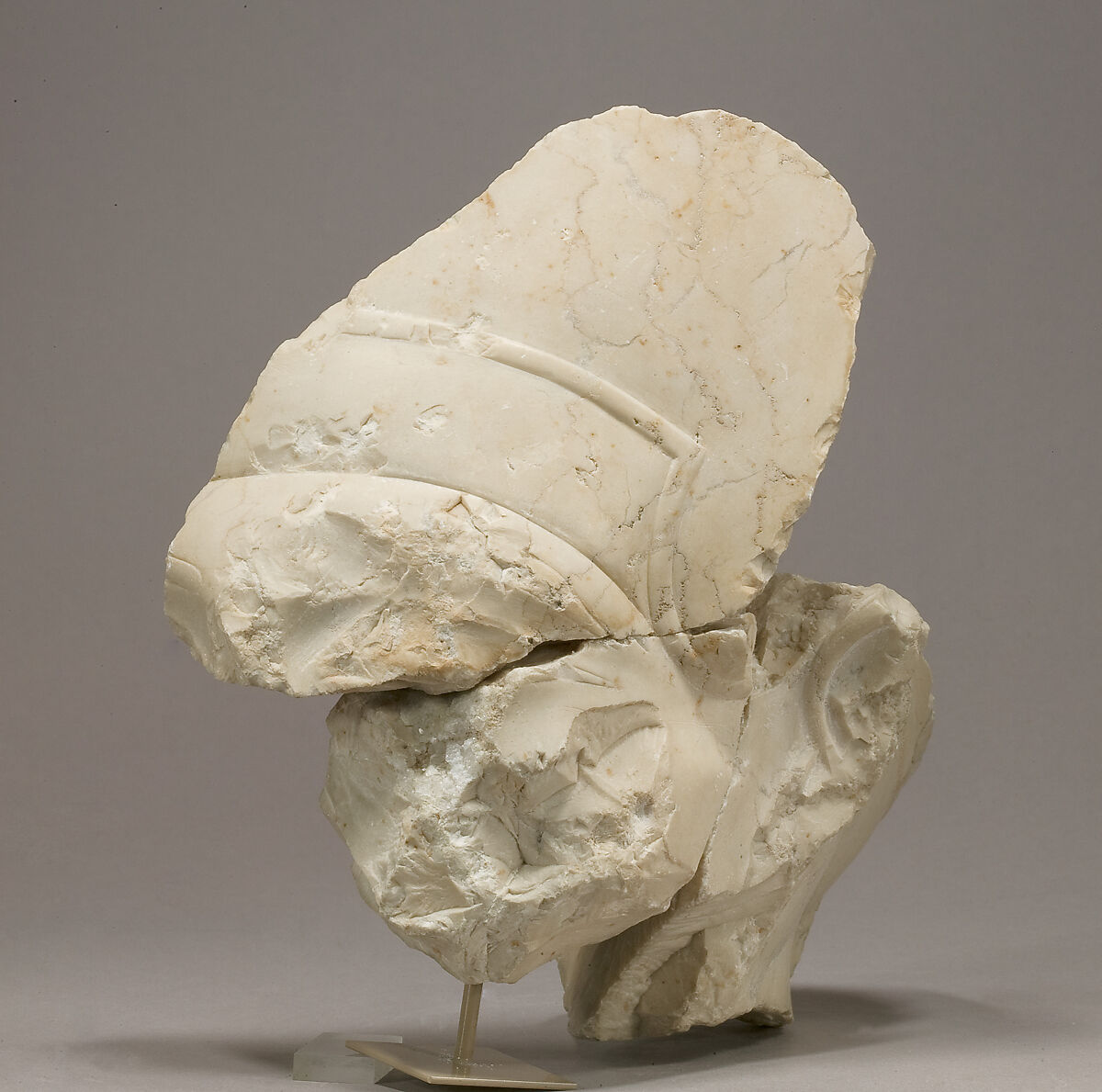 Head of Akhenaten in the blue crown, sign traces at nape of neck, Indurated limestone