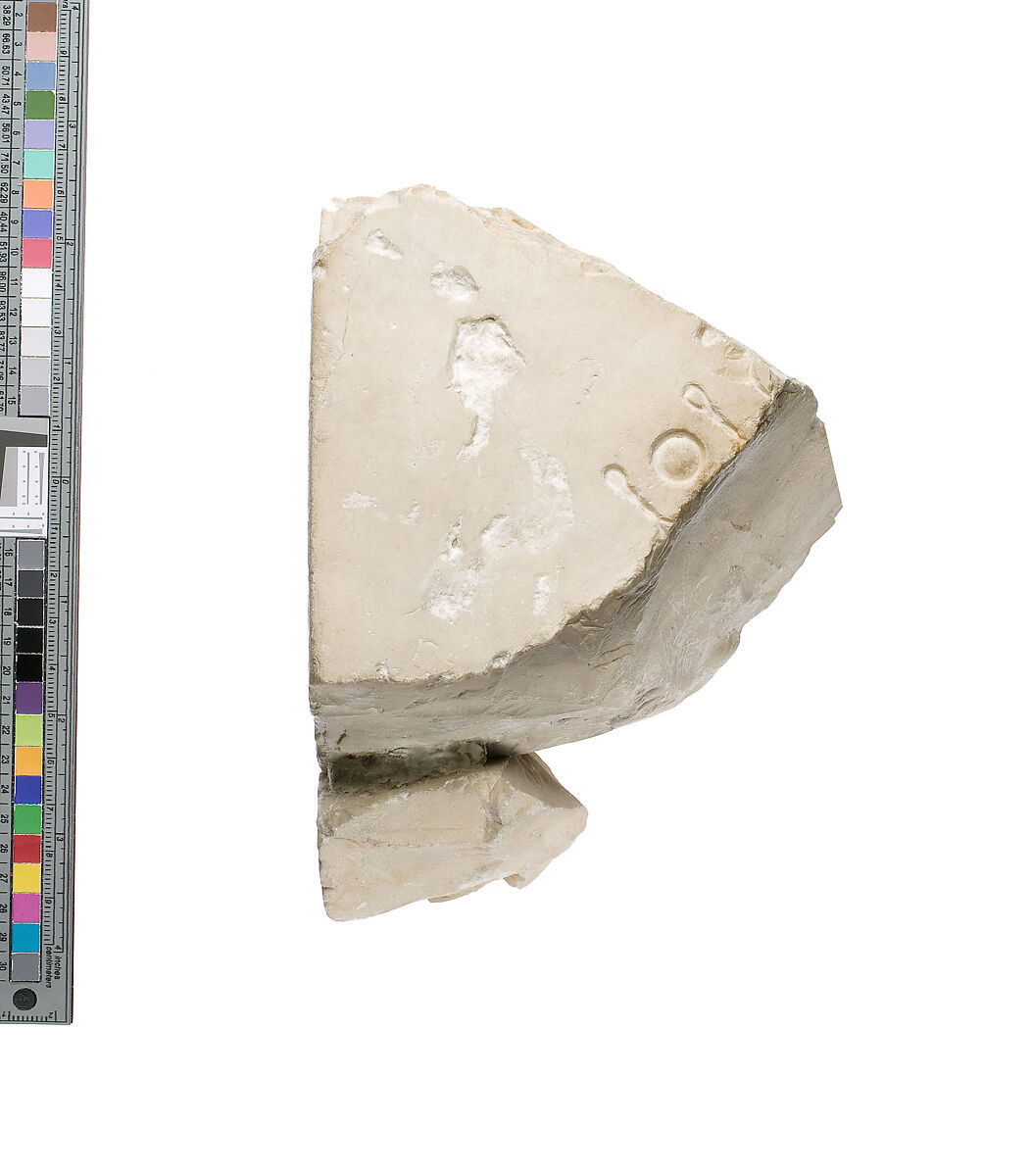 Inscribed pillar and support area against body, Indurated limestone