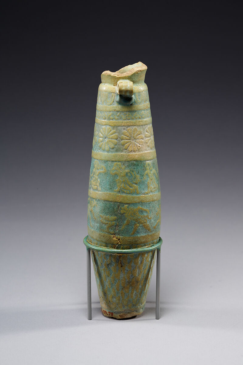 Biconical alabastron with zones of bichrome decoration including floral elements, dancers, and Bes-like figures, Faience