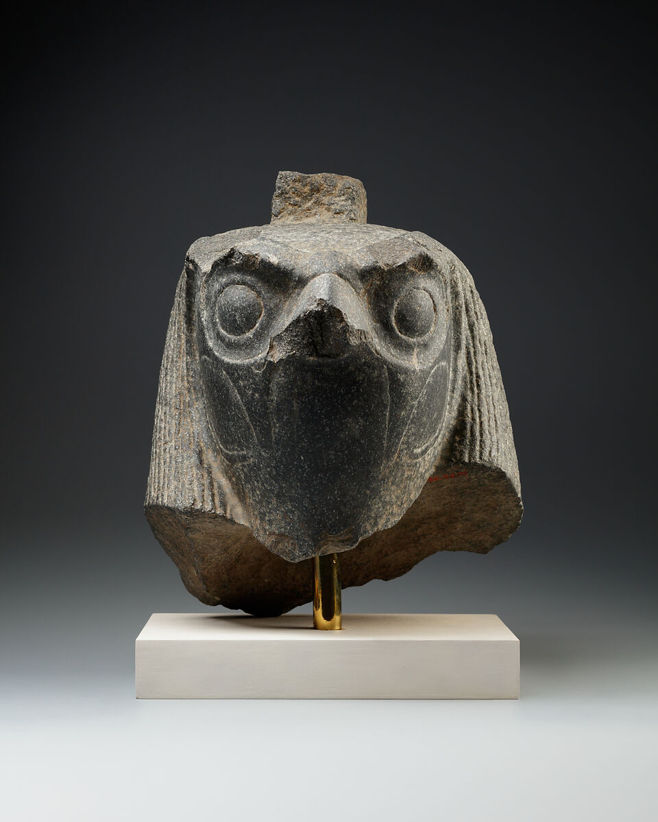 Falcon head with divine wig from a statue with an anthropomorphic body, Diorite 