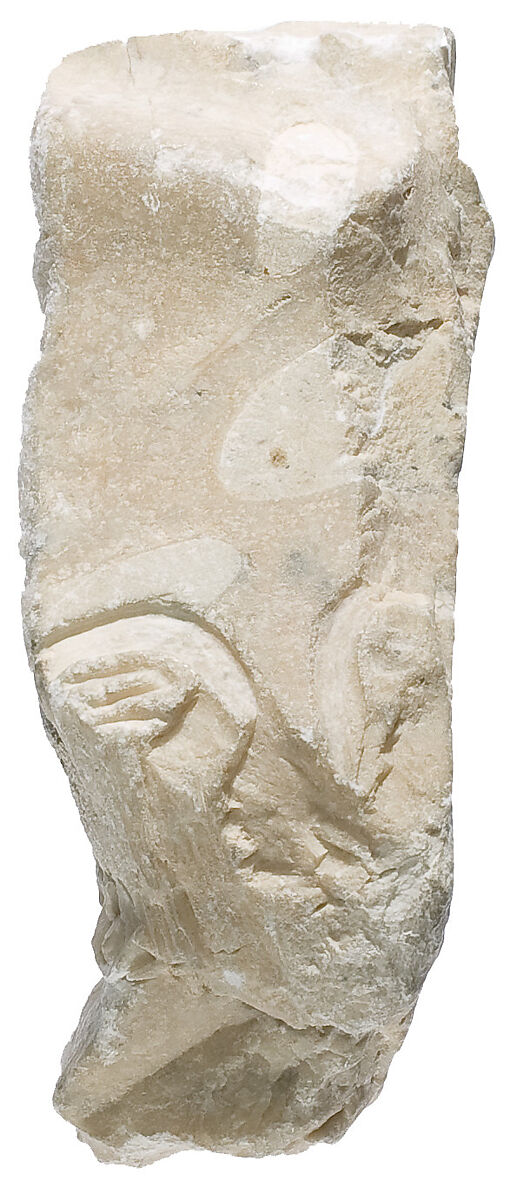 Chest fragment with traces of Aten cartouches, Indurated limestone 
