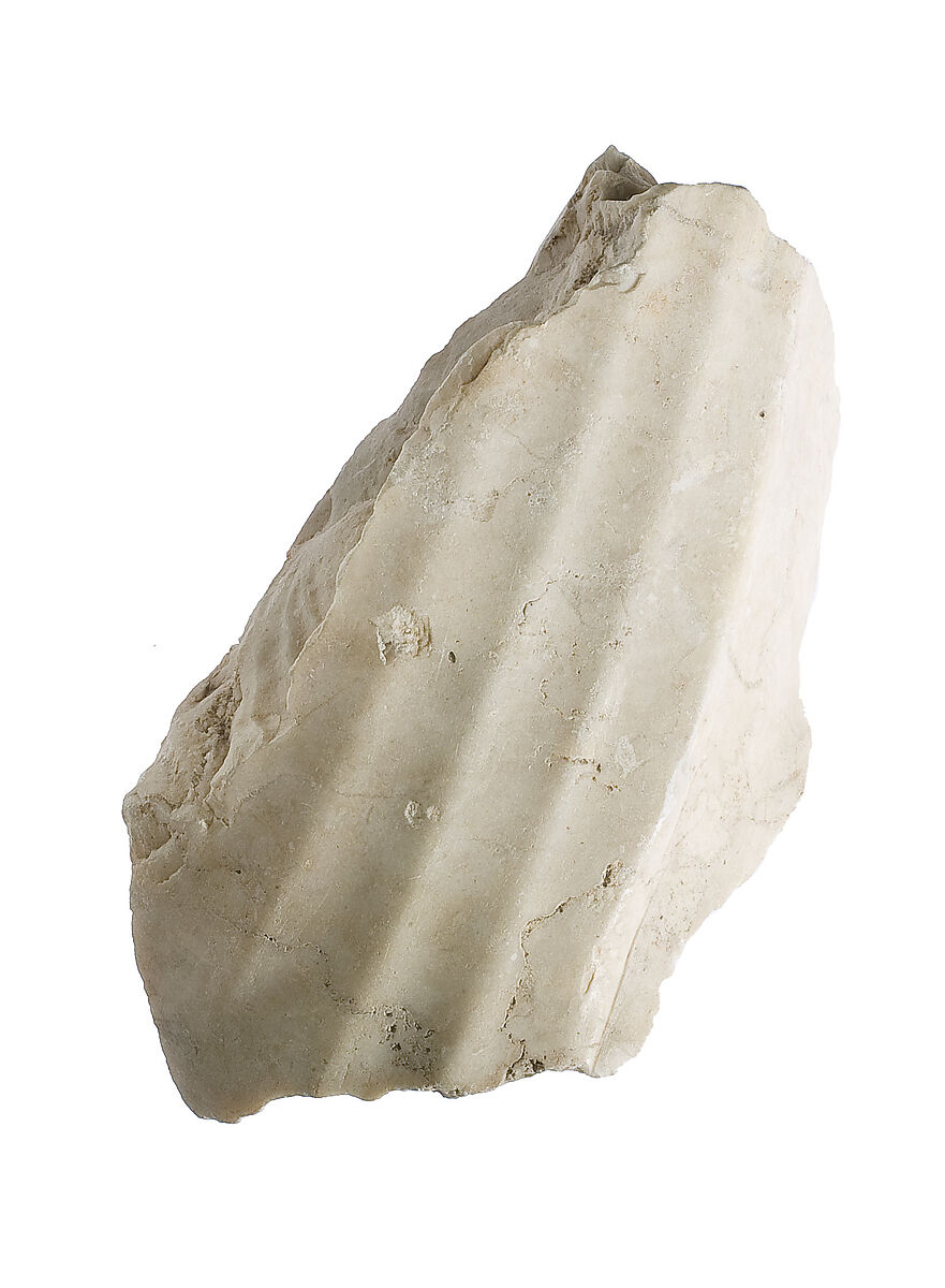 Garment fragment, royal kilt  at knee, Indurated limestone 