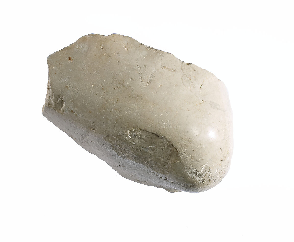 Elbow, with garment, Indurated limestone