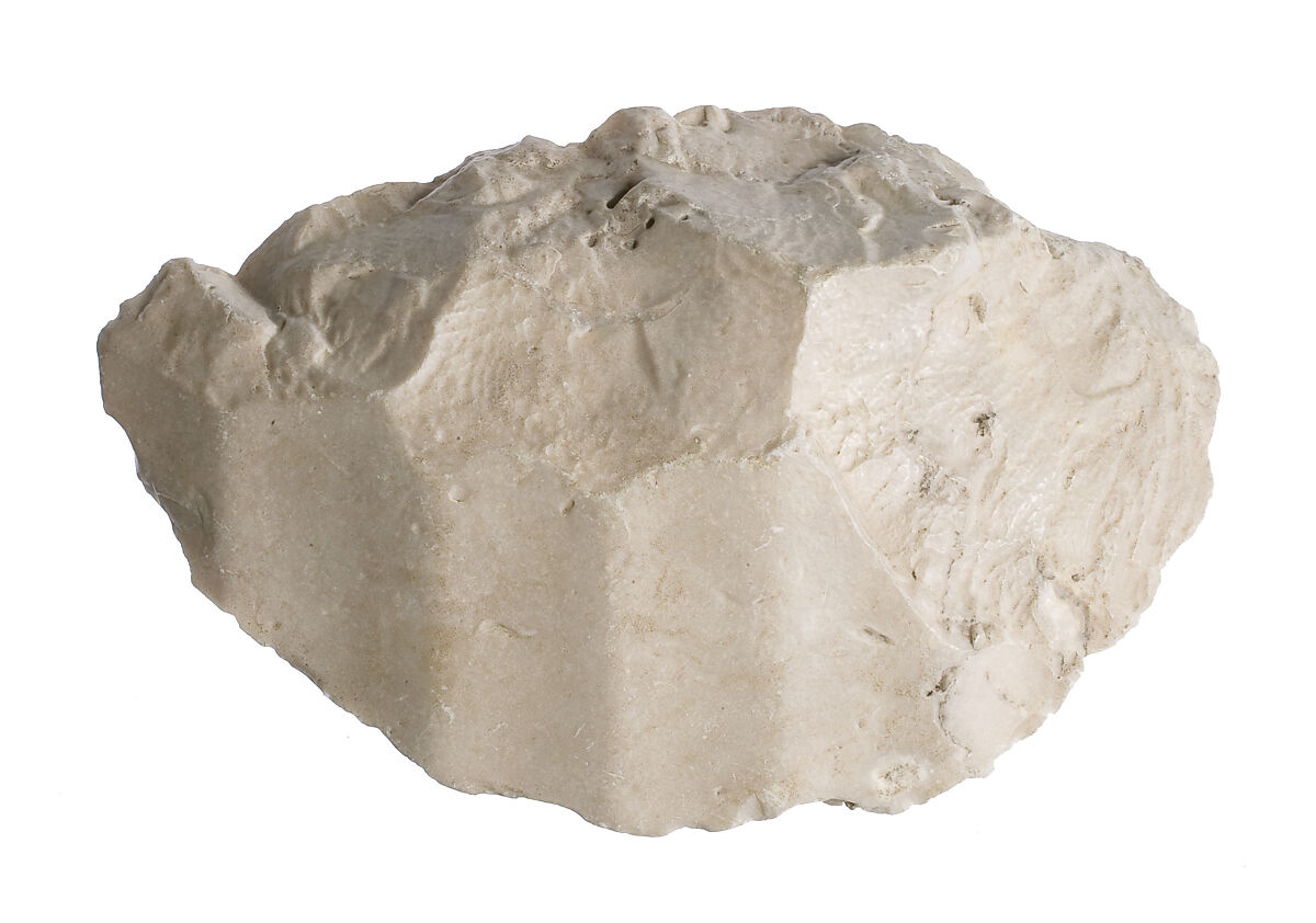 Body (thigh ?) with garment, pleating, Indurated limestone 