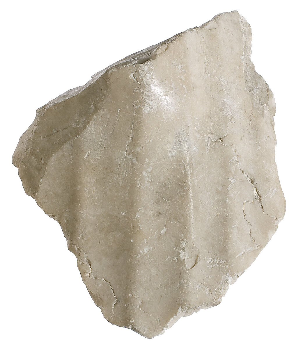 Knee with garment, pleats, Indurated limestone 