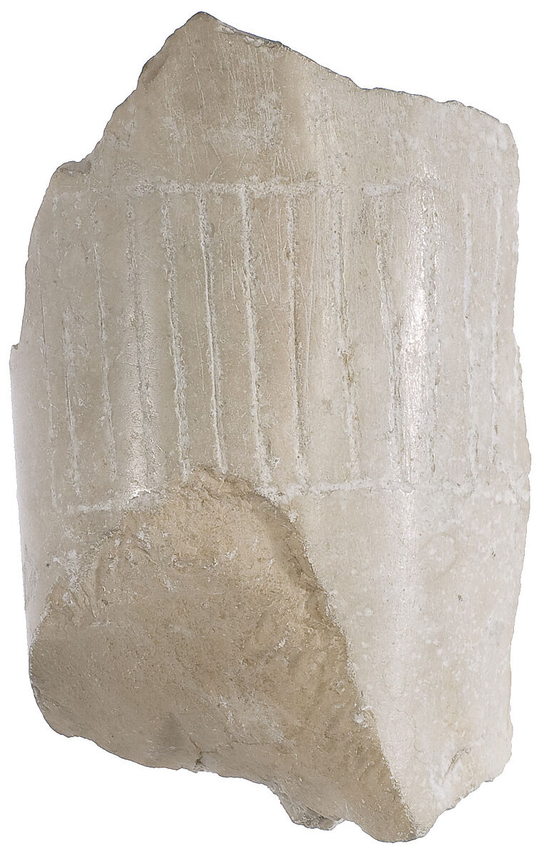 Pleated garment with selvage at ankle, Indurated limestone 