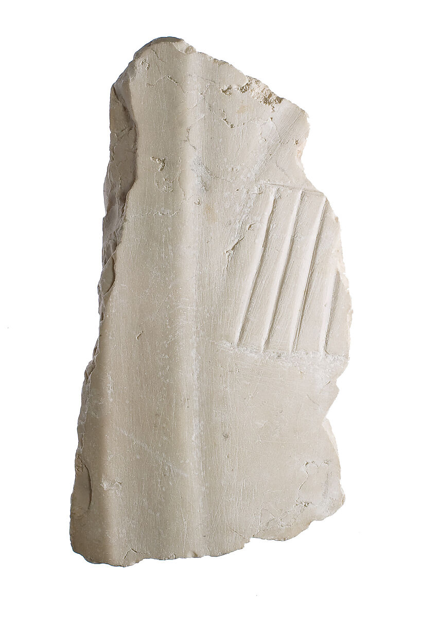 Lower legs area with fringe of shawl, Indurated limestone 
