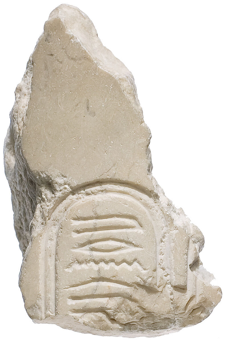 Right shoulder with Aten cartouche, Indurated limestone 