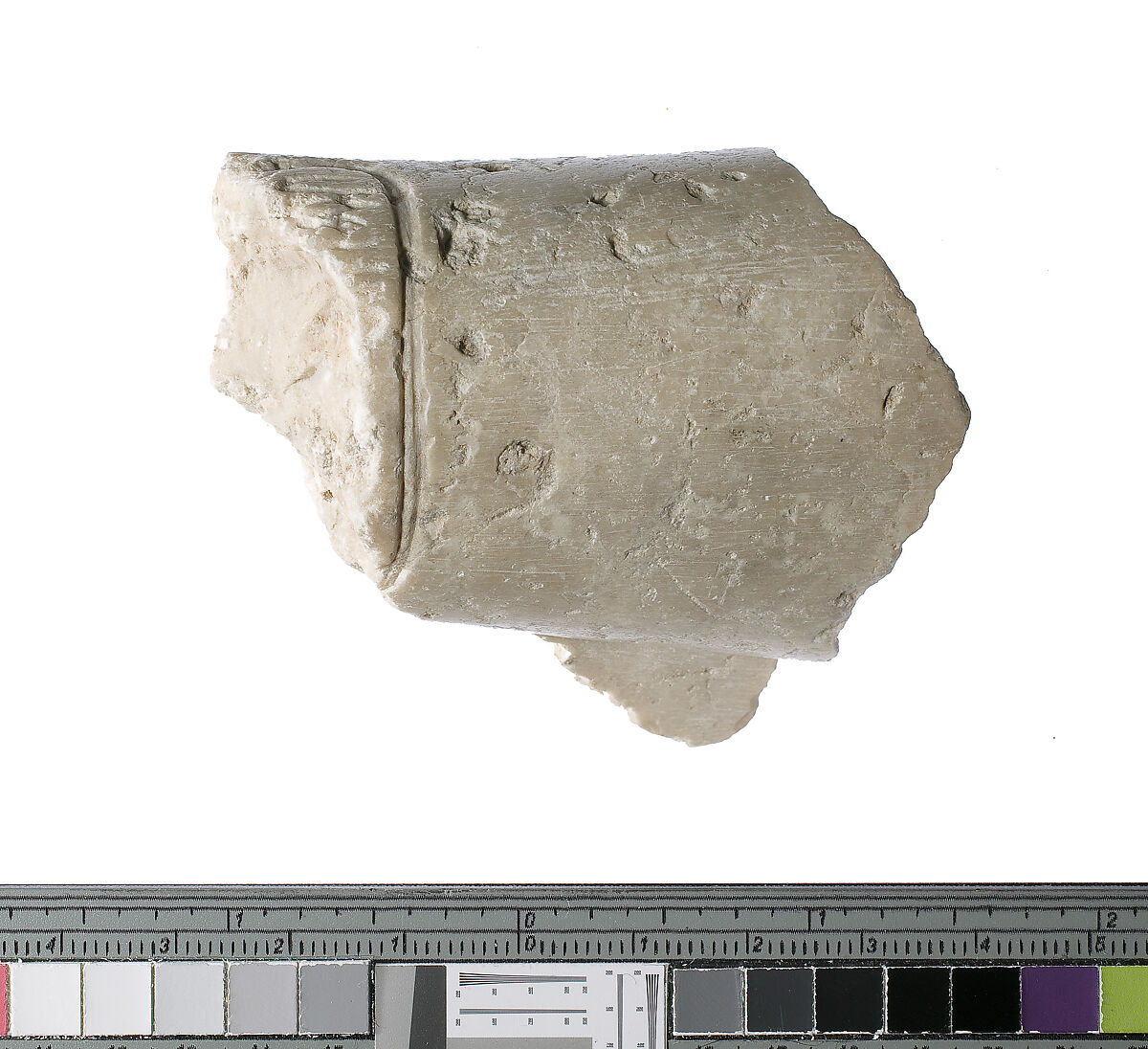 Left forearm with Aten cartouche, Indurated limestone 