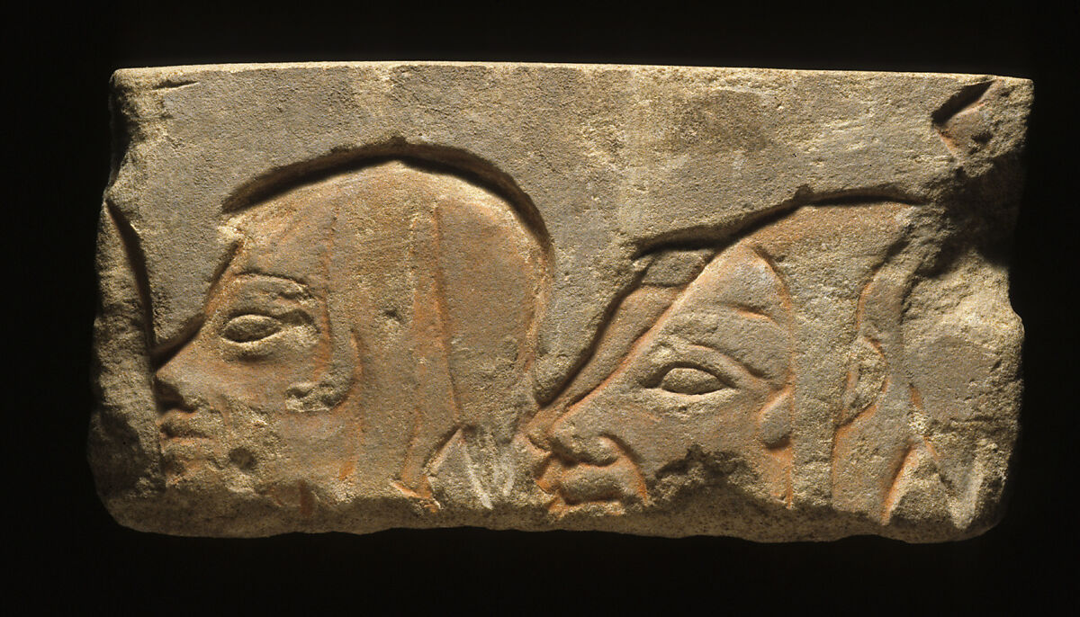 Relief block with the heads of three Libyans, Sandstone, paint 