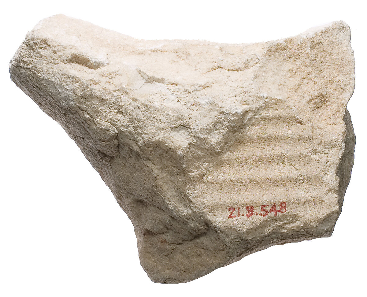 Pleated garment and raised area, insert (?), Siliceous indurated limestone 