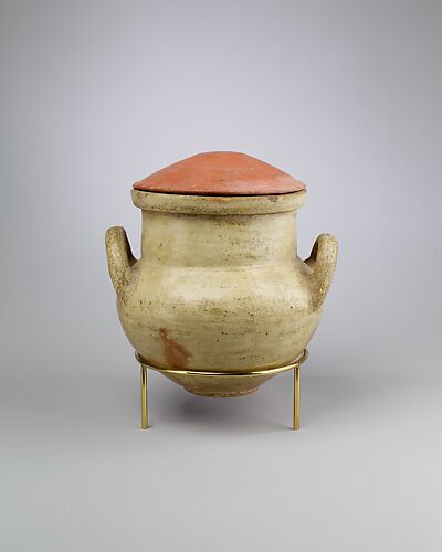 Vessel with strap handles and a lid