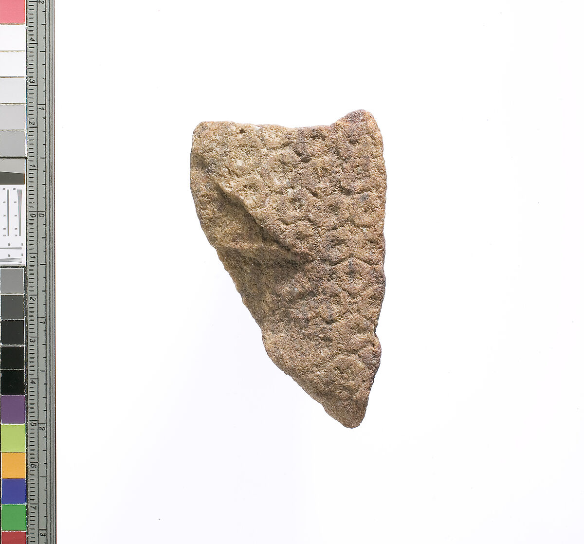 Crown with discs, two adjoining surfaces, Red quartzite