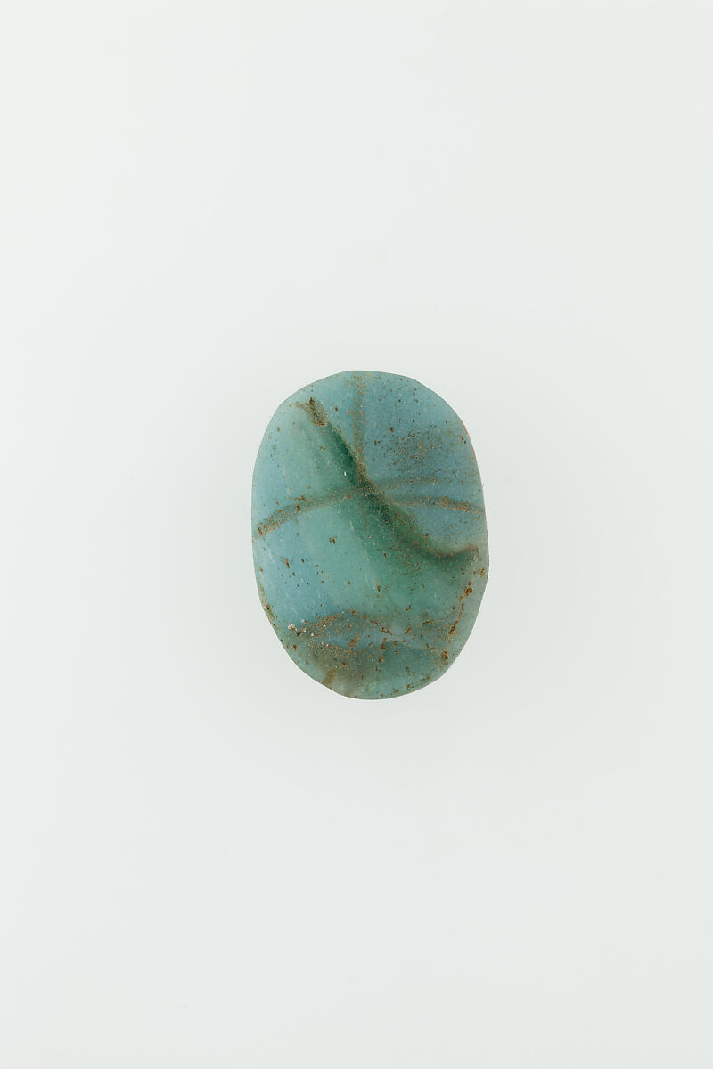 Uninscribed glass scarab, Pale blue glass