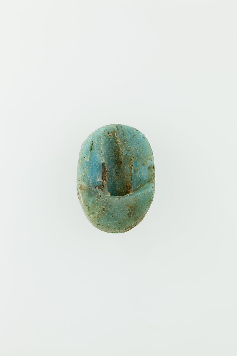 Uninscribed glass scarab, Pale blue glass 