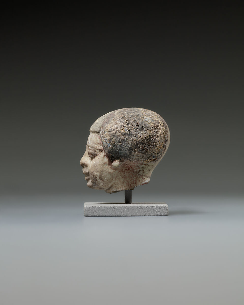 Head from a statuette, perhaps of a dwarf, Faience