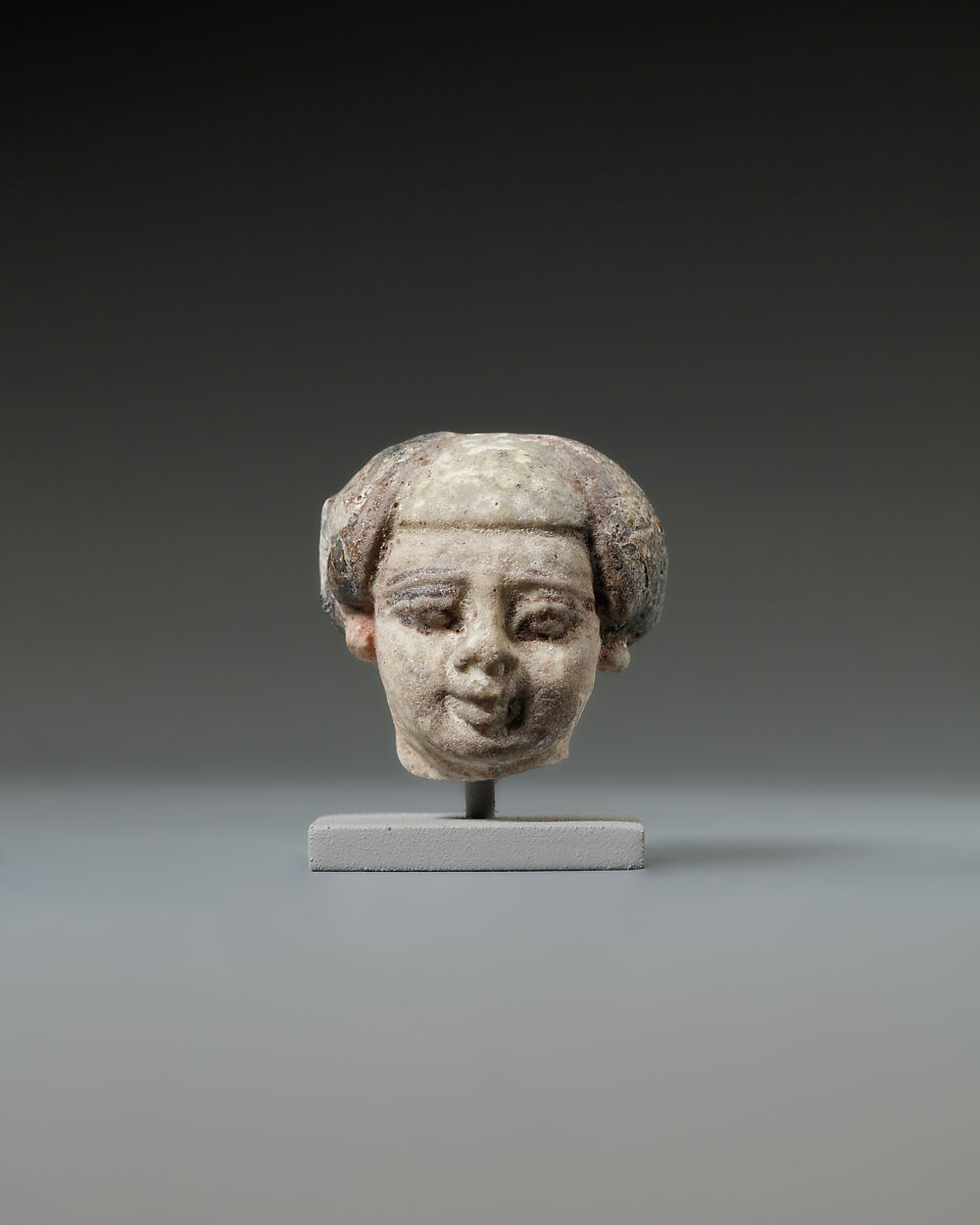 Head from a statuette, perhaps of a dwarf, Faience 