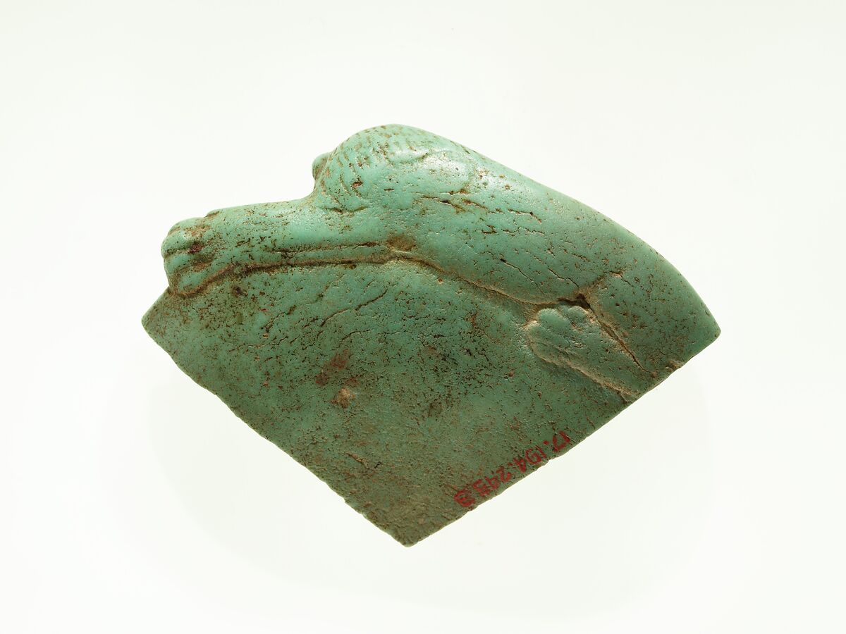 Fragment of a dish with a lion reclining on the rim, Faience