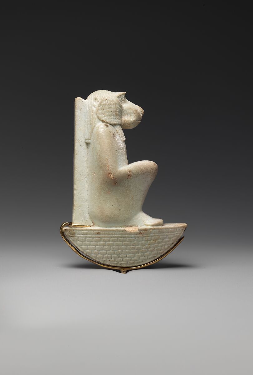 Figure of baboon on a basket and with a pillar, the shebet offering, Faience