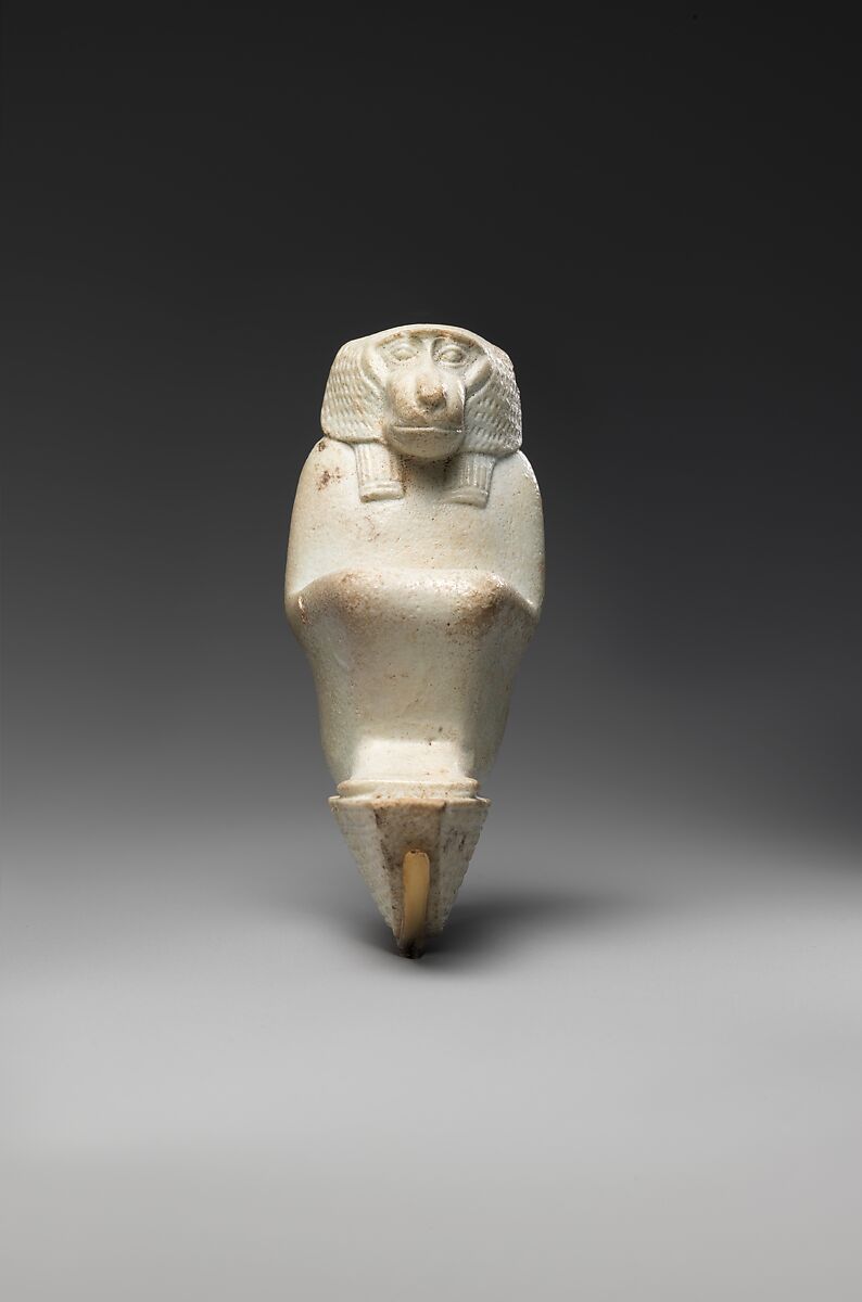 Figure of baboon on a basket and with a pillar, the shebet offering, Faience
