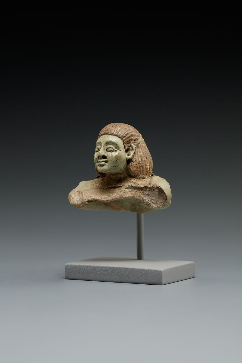 Head and Torso from a Male Swimmer Holding a Spoon, Faience