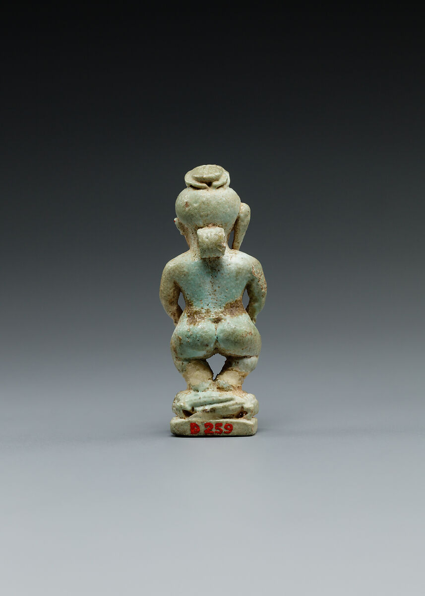 Amulet: Pataikos astride crocodiles and with a scarab on his head, Faience