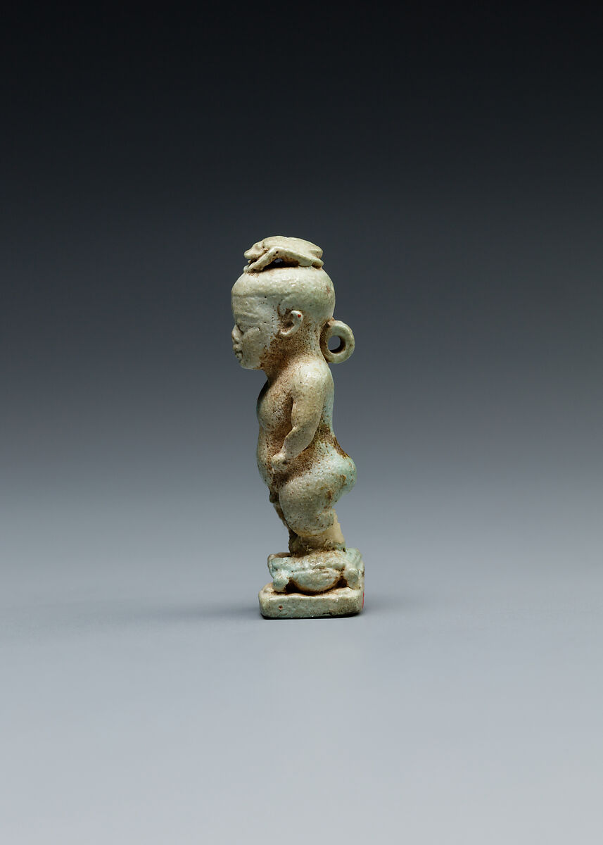 Amulet: Pataikos astride crocodiles and with a scarab on his head, Faience