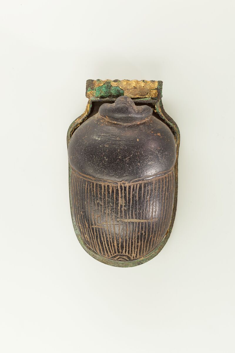 Heart Scarab with a Human Head, Basalt, bronze, remains of gold leaf