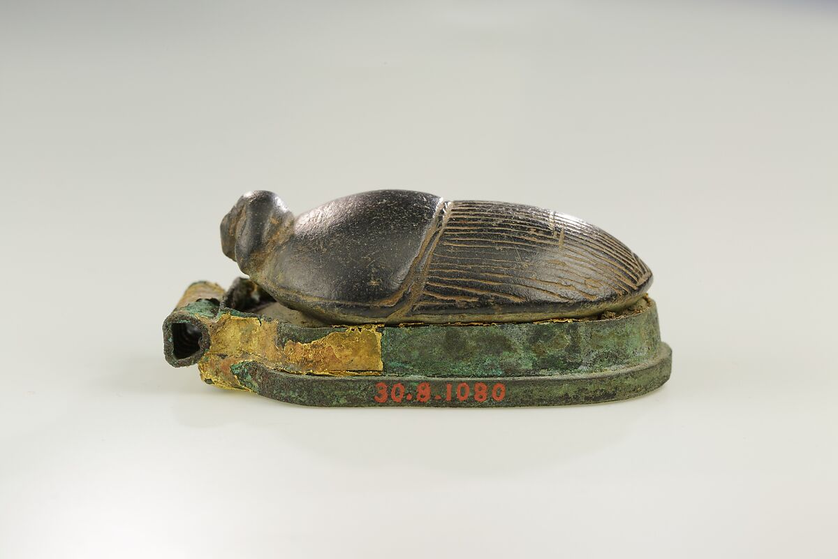 Heart Scarab with a Human Head, Basalt, bronze, remains of gold leaf