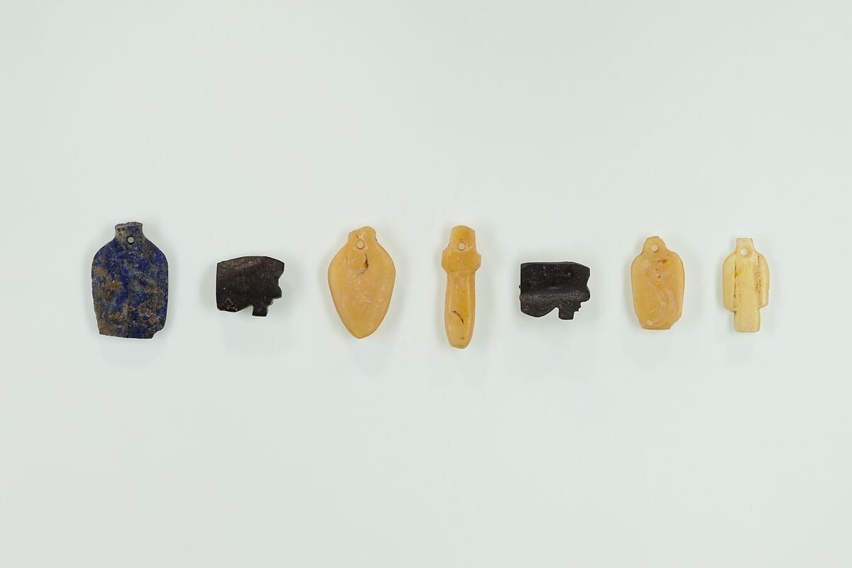 Group of 7 amulets, Lapis lazuli, hematite, carnelian 