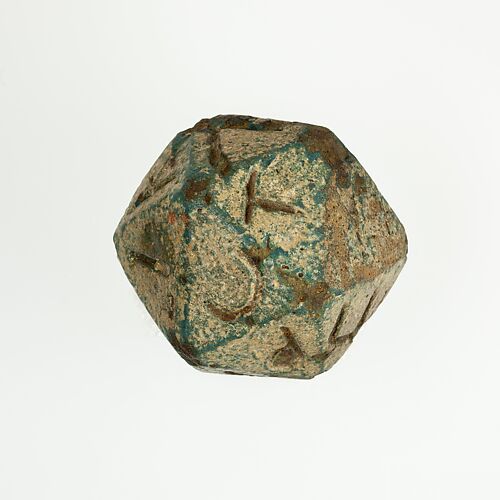 Twenty-sided die (icosahedron) with faces inscribed with Greek letters