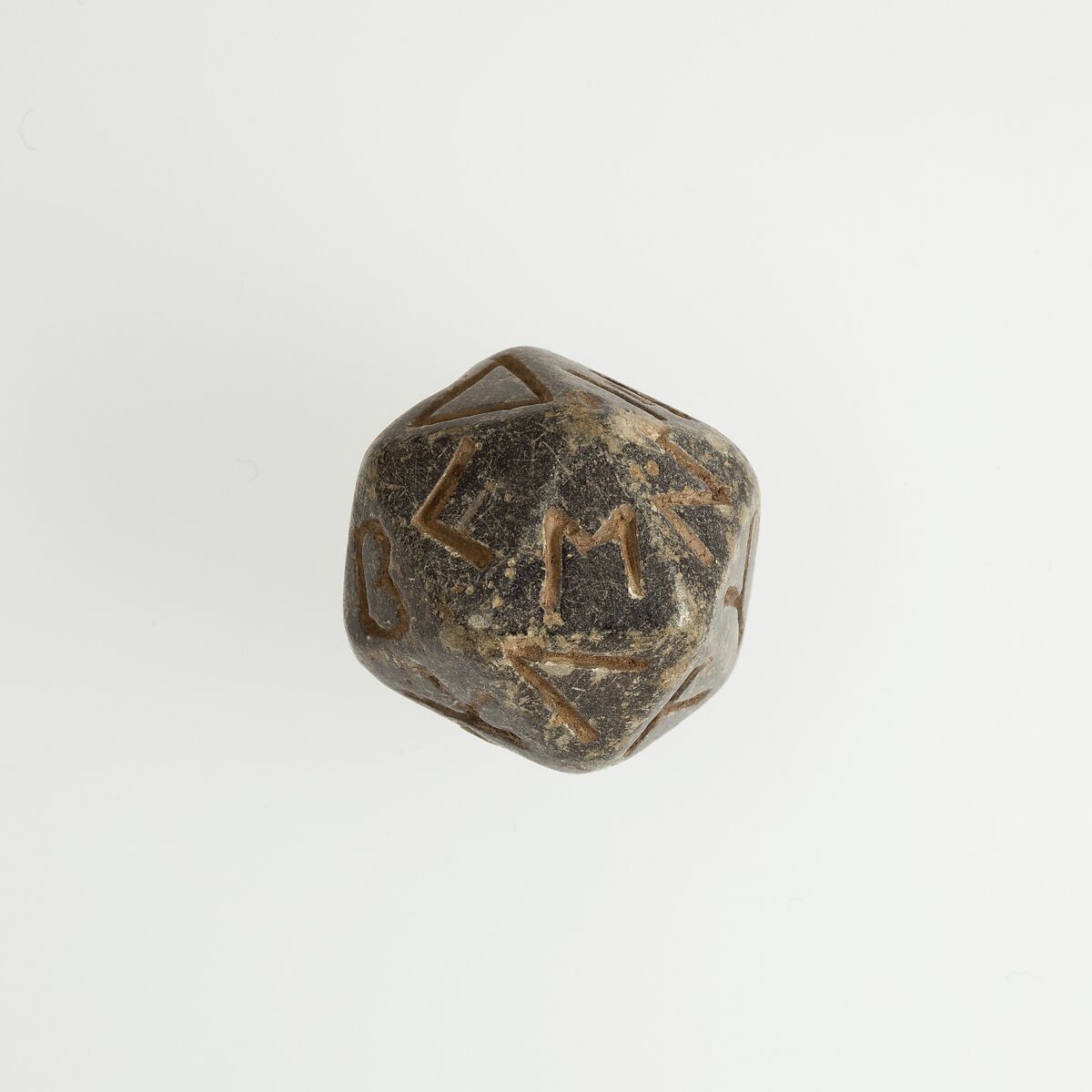 Twenty-sided die (icosahedron) with faces inscribed with Greek letters, Serpentinite 
