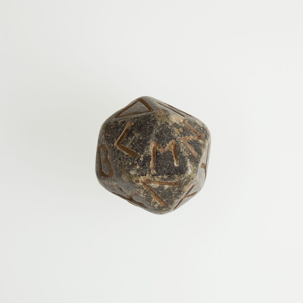 Twenty-sided die (icosahedron) with faces inscribed with Greek