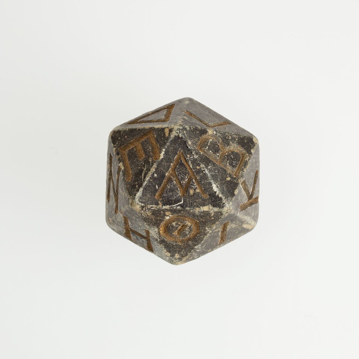 Twenty-sided die (icosahedron) with faces inscribed with Greek letters, Serpentinite