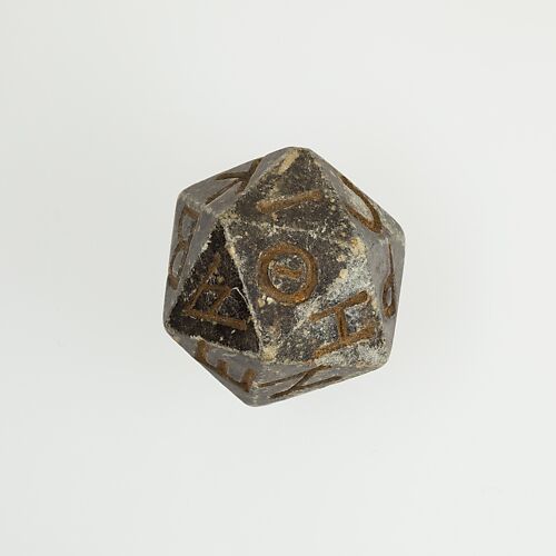 Twenty-sided die (icosahedron) with faces inscribed with Greek letters