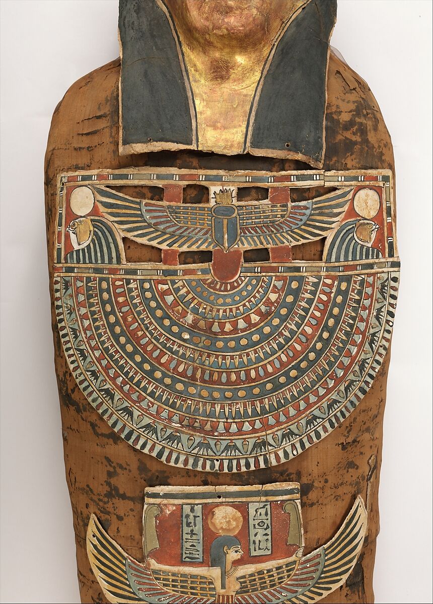 Mummy of Nesmin with plant wreath, mask, and other cartonnage elements, Mummified human body, linen, mummification material, faience? (amulets), painted and gilded cartonnage, plant remains