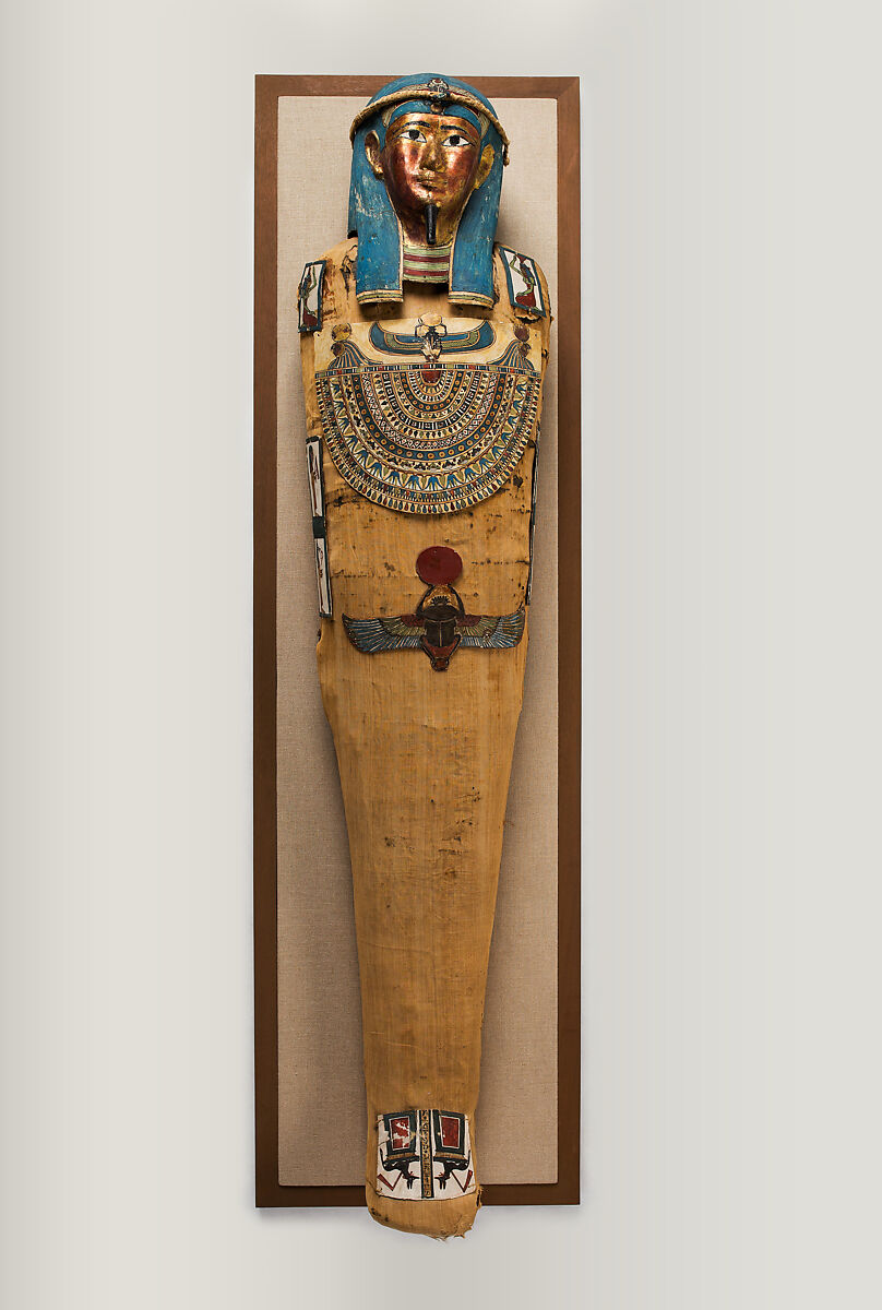 Mummy of Irtirutja with mask and other cartonnage elements, Mummified human body, linen, mummification materials, painted and gilded cartonnage